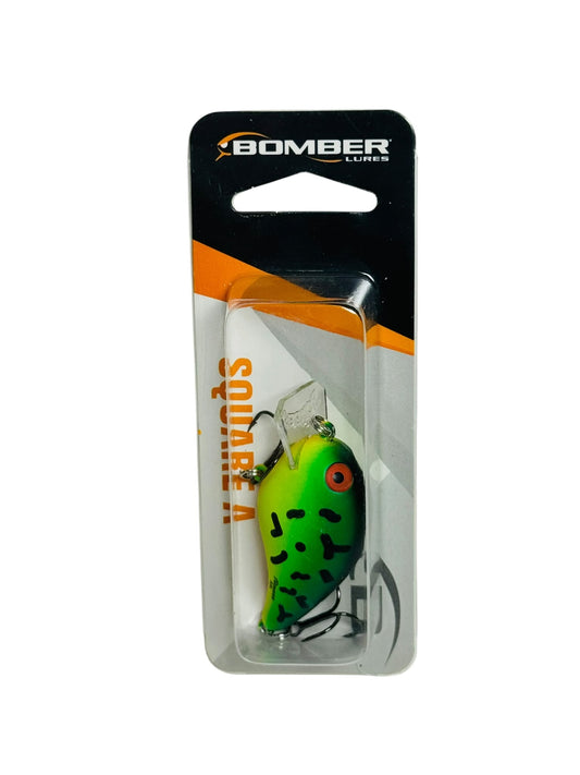 Bomber Square A fishing lure in retail packaging, green and yellow with black marks